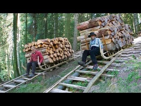 Amazing Way These Old French Men Slide Tons of Wood Downhill